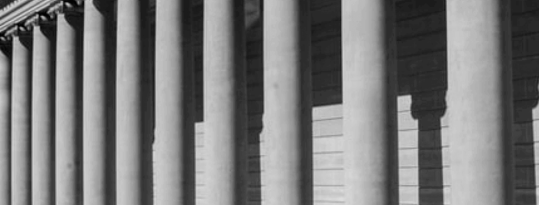 white pillars in front of a courthouse